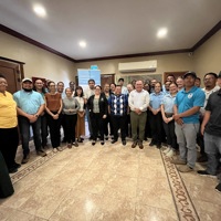 Group of people posing for photo